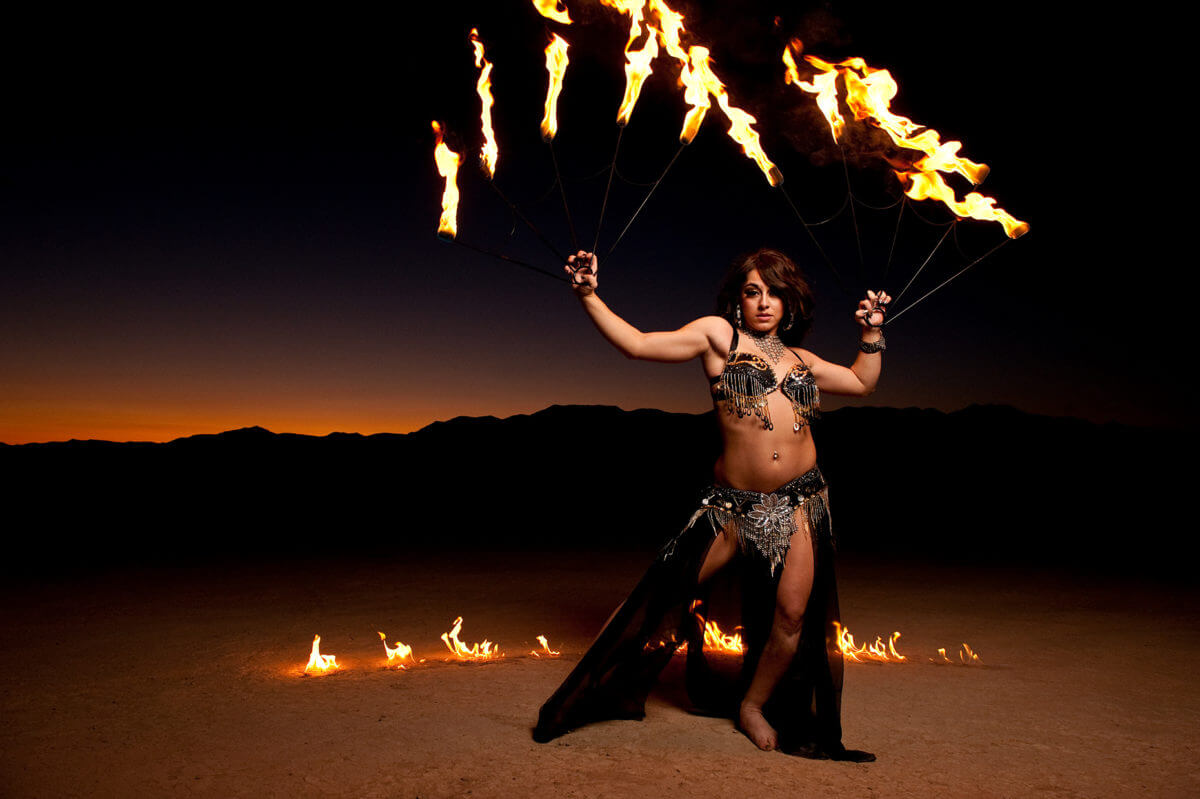 Las Vegas,  NV.  show girl on a dry lake bed.